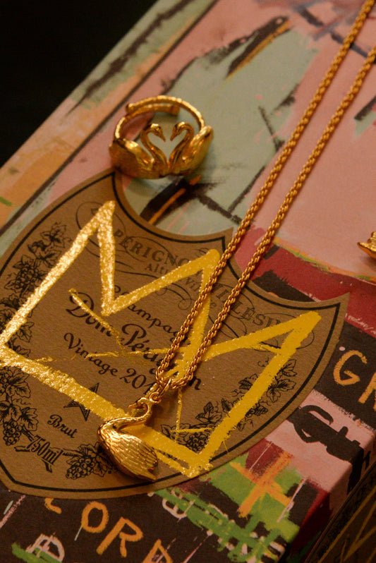 GOLD CHARM SWAN NECKLACE