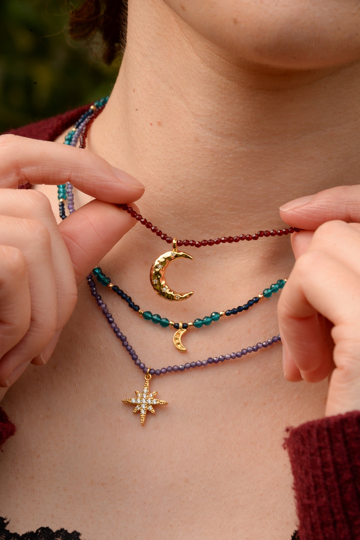 GOLD CZ STAR CHARM ON BLUE BEADED NECKLACE