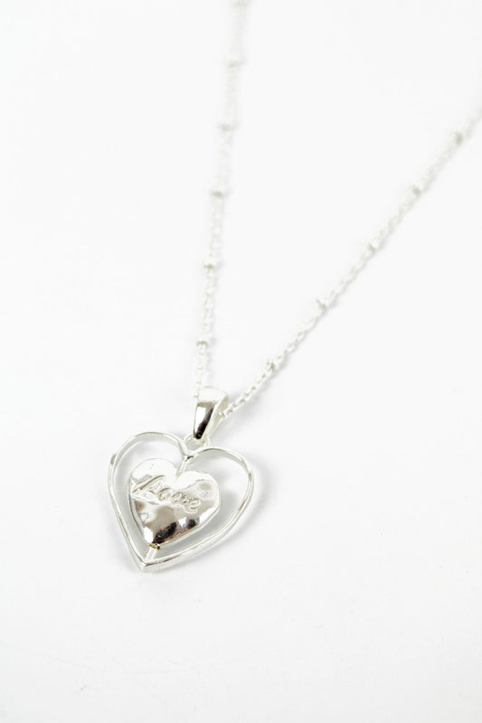 SILVER SPINNING HEART PENDANT