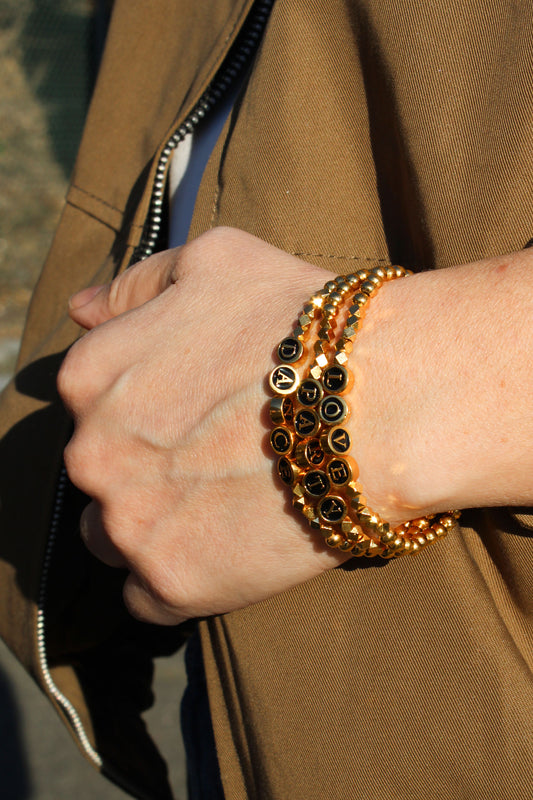 OFFER | BEADED GOLD AND BLACK SLOGAN BRACELETS: PACK OF 3