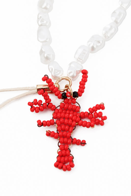 PEARL BEAD PHONE CHAIN WITH RED LOBSTER CHARMS