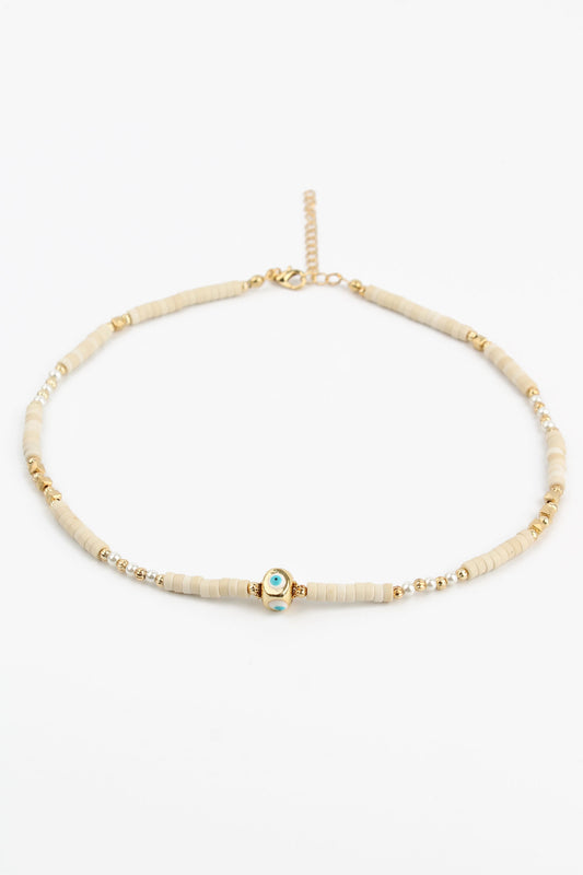 COLLIER PERLES CRÈME ET CHARM ŒIL DORÉ