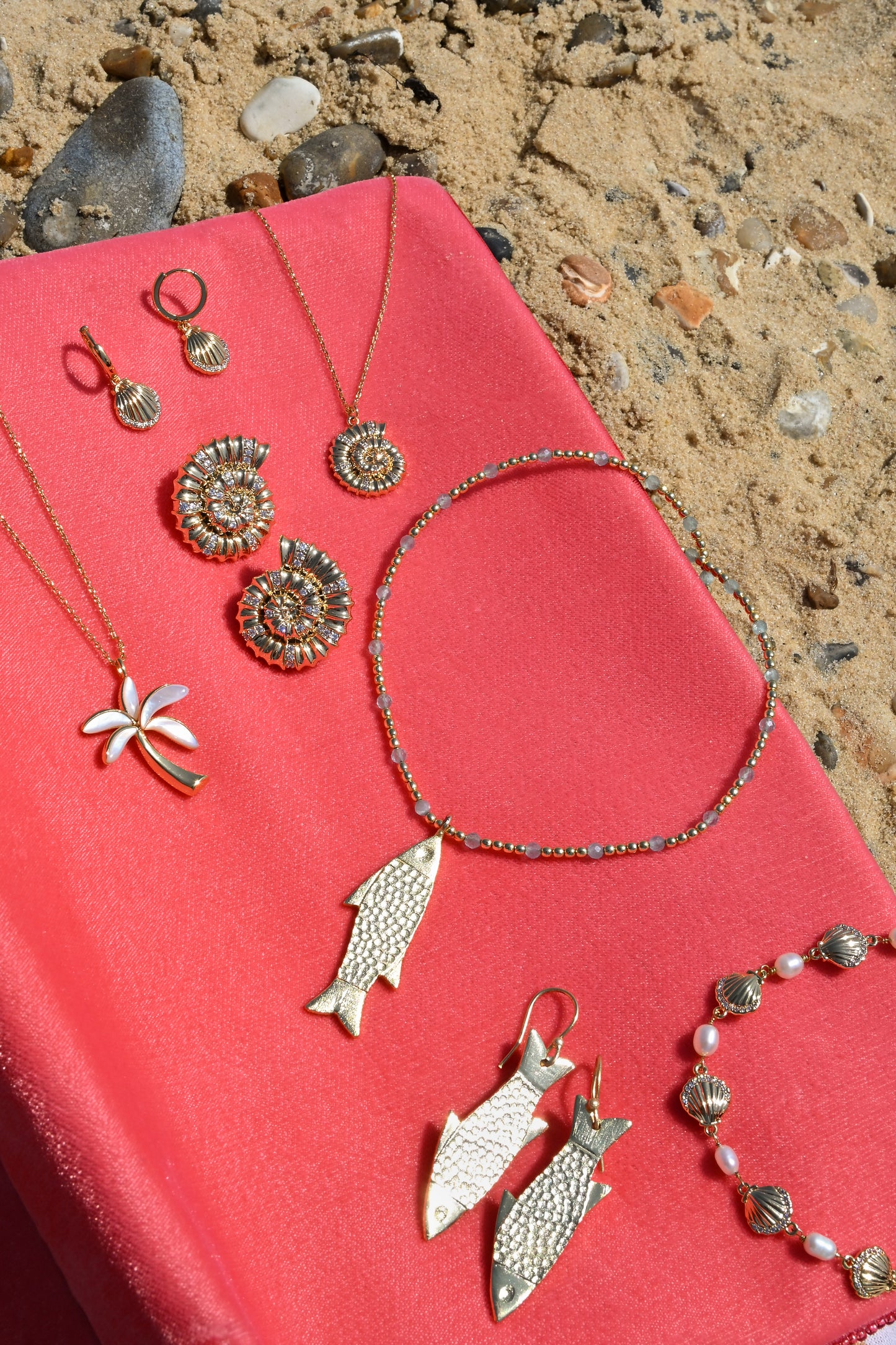 FISH CHARM ON GOLD AND BLUE NECKLACE