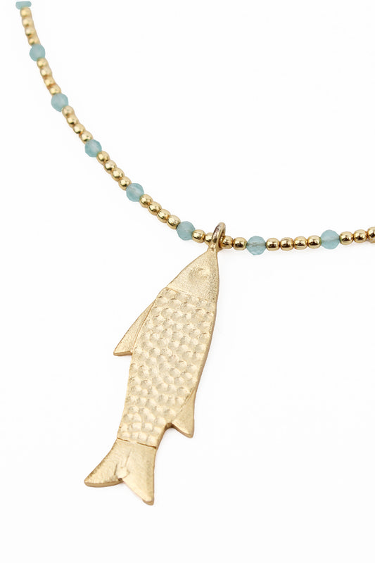 FISH CHARM ON GOLD AND BLUE NECKLACE