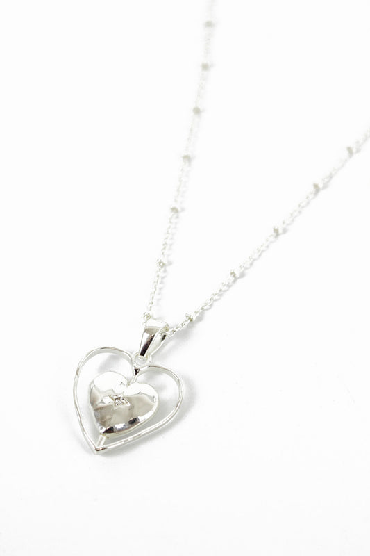 SILVER SPINNING HEART PENDANT