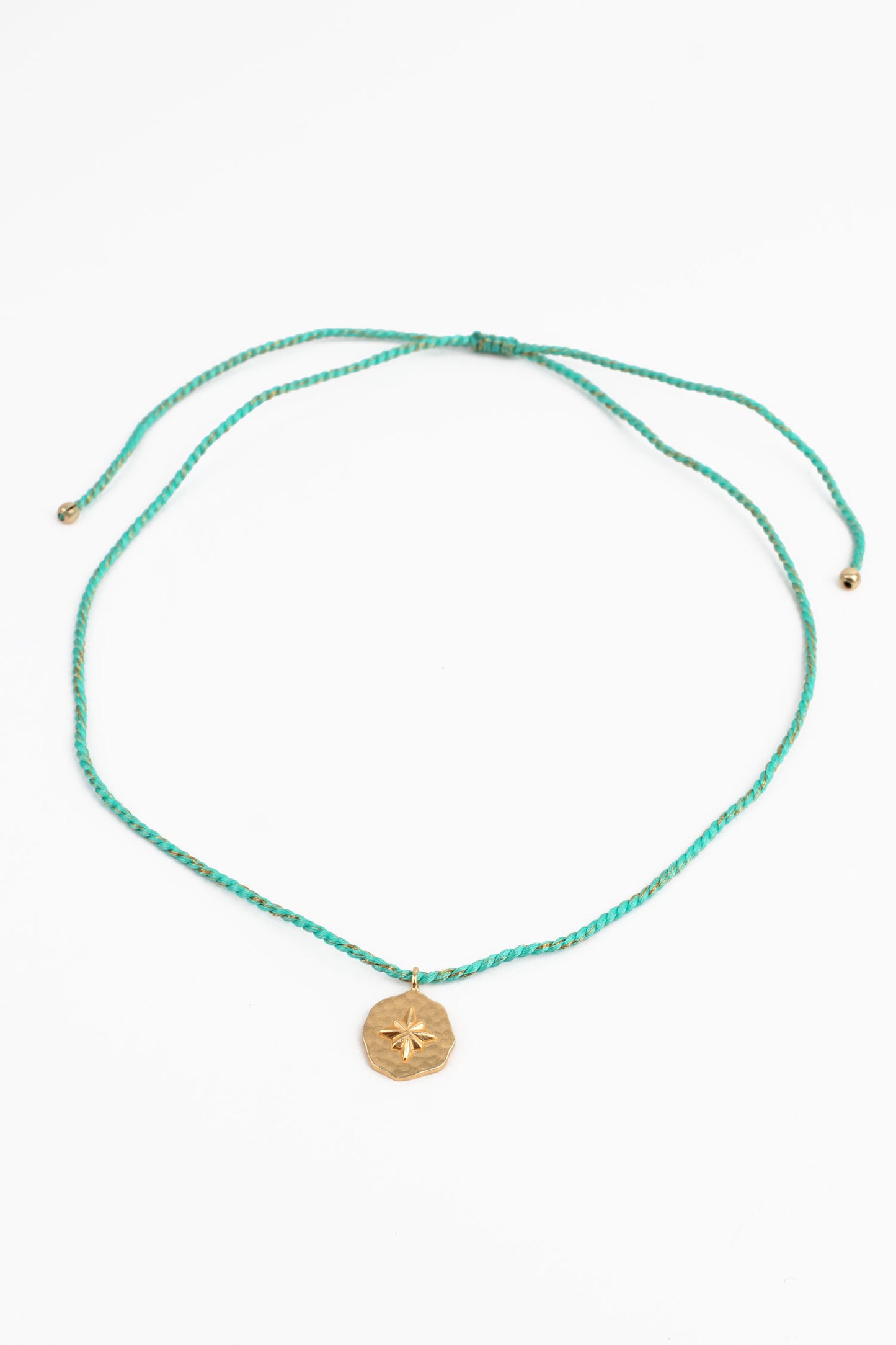 STAR ROUND CHARM ON TURQUOISE BLUE THREAD NECKLACE