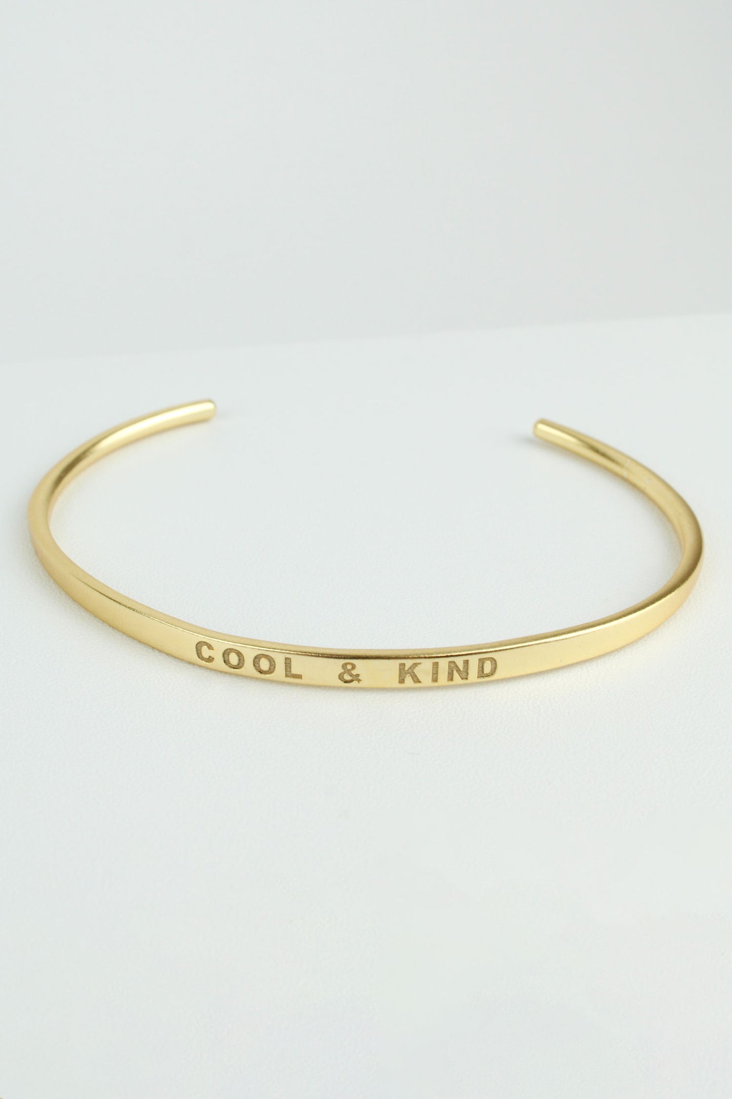GOLD 'COOL & KIND' STAMP QUOTE BANGLE (7879520944344)