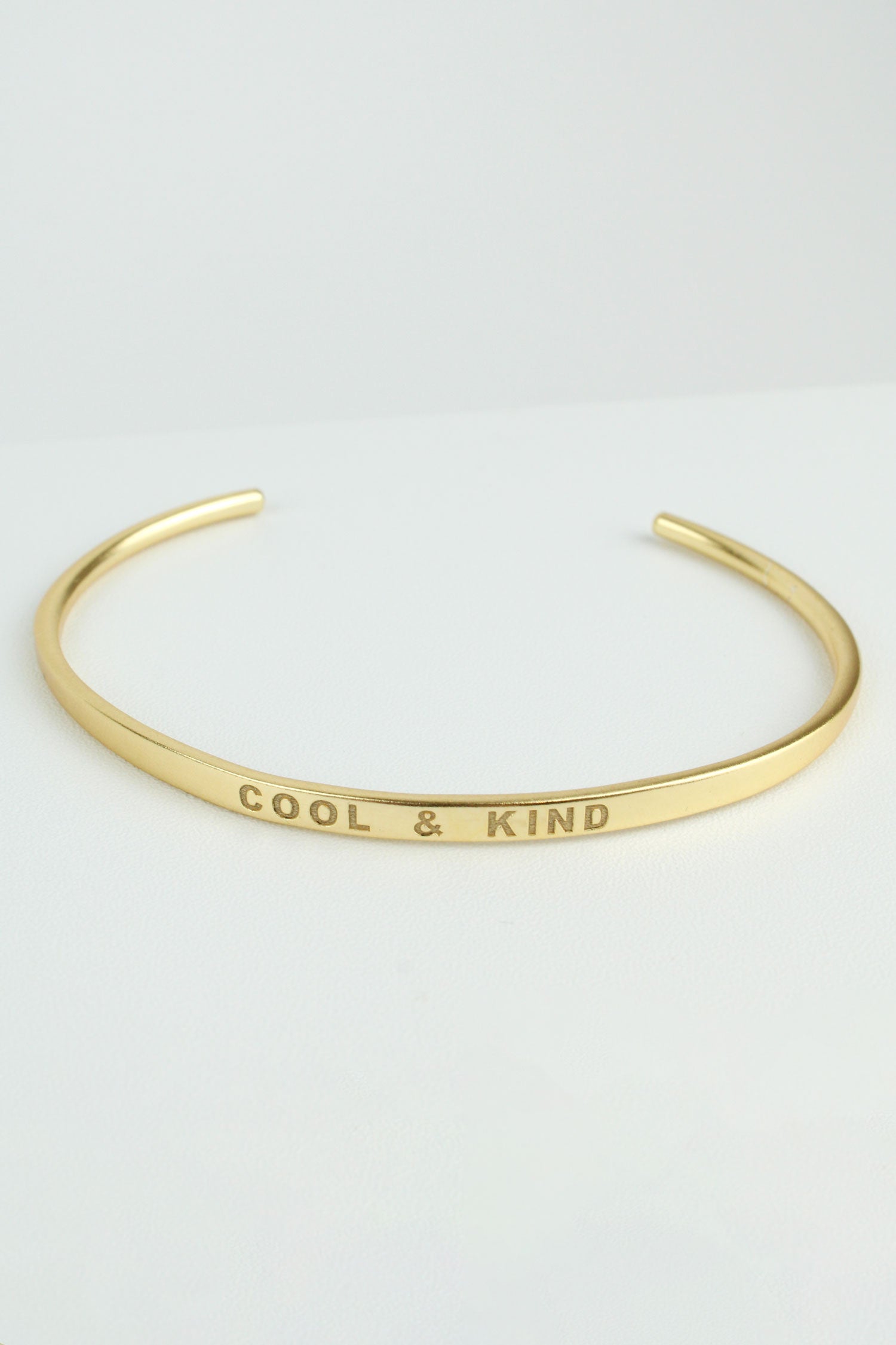 GOLD 'COOL & KIND' STAMP QUOTE BANGLE (7879520944344)