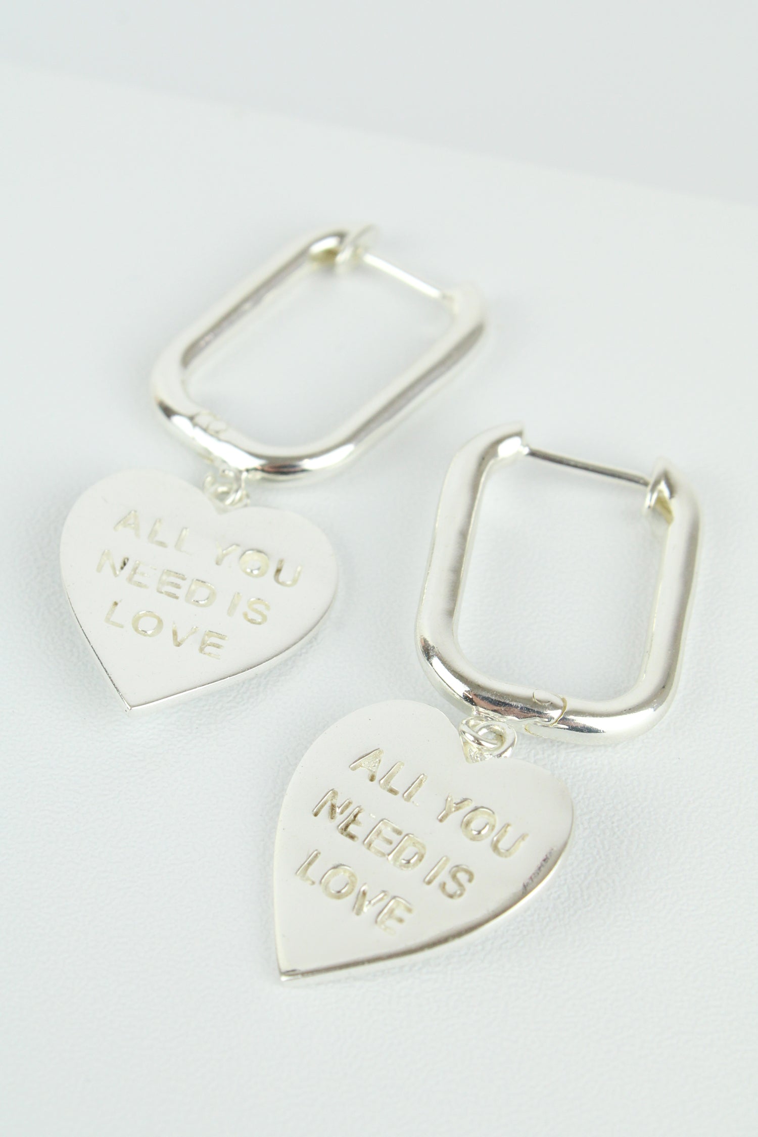 SILVER ALL YOU NEED IS LOVE HEART CHARM HOOPS (7896130453720)